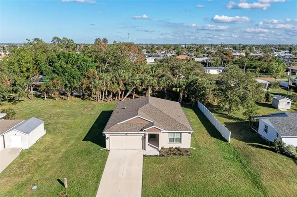a aerial view of a house with a yard
