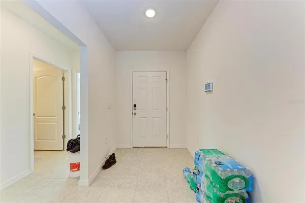 a view of hallway with cabinet and painted walls