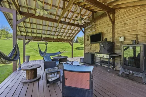 a view of a house with a yard porch and sitting area