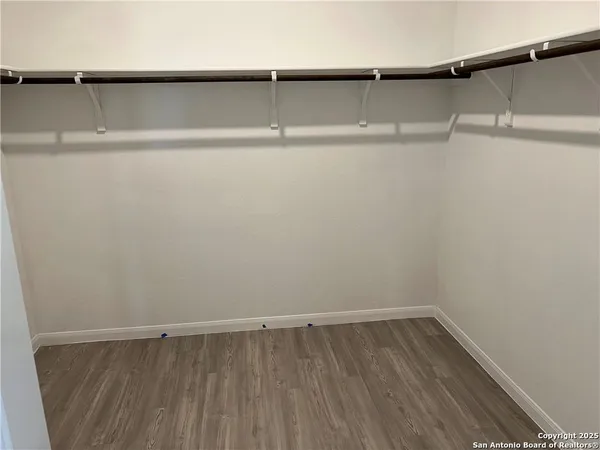 a view of a room with shelf on the wall