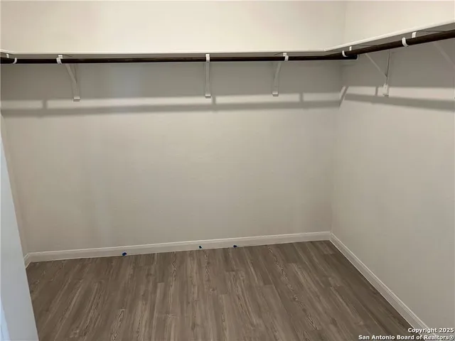 a view of a room with shelf on the wall