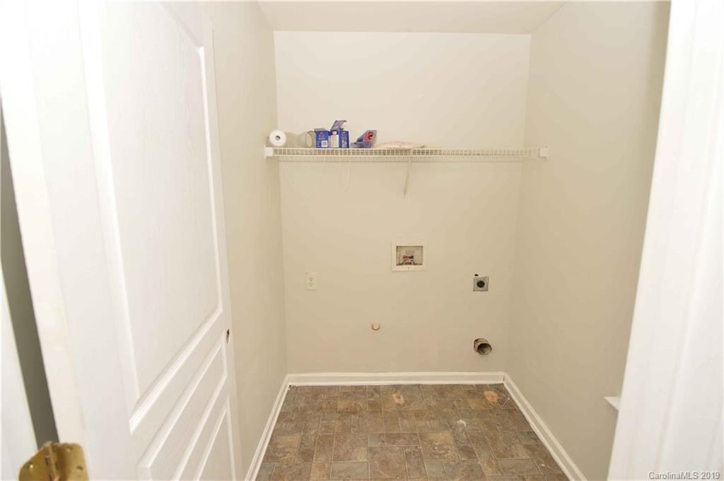 4918 Elizabeth Road Charlotte, NC 28269 - Photo 8 of 18 a view of walk in closet with wooden floor