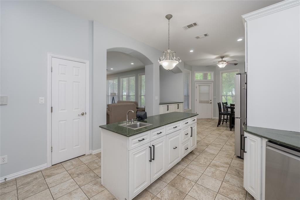 135 Kirkpatrick Road Ennis, TX 75119 - Photo 10 of 40 a bathroom with a granite countertop sink and a mirror