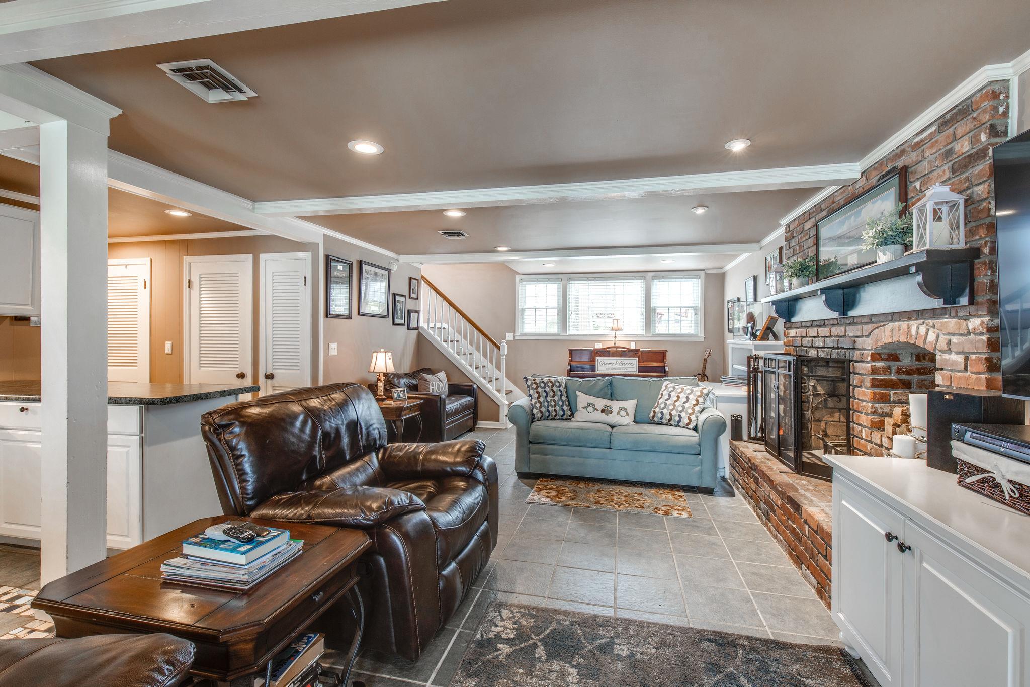 382 Green Harbor Road Old Hickory, TN 37138 - Photo 17 of 30 Basement Level Living Room/ Rec Room with tile floors, Fireplace and Built Ins