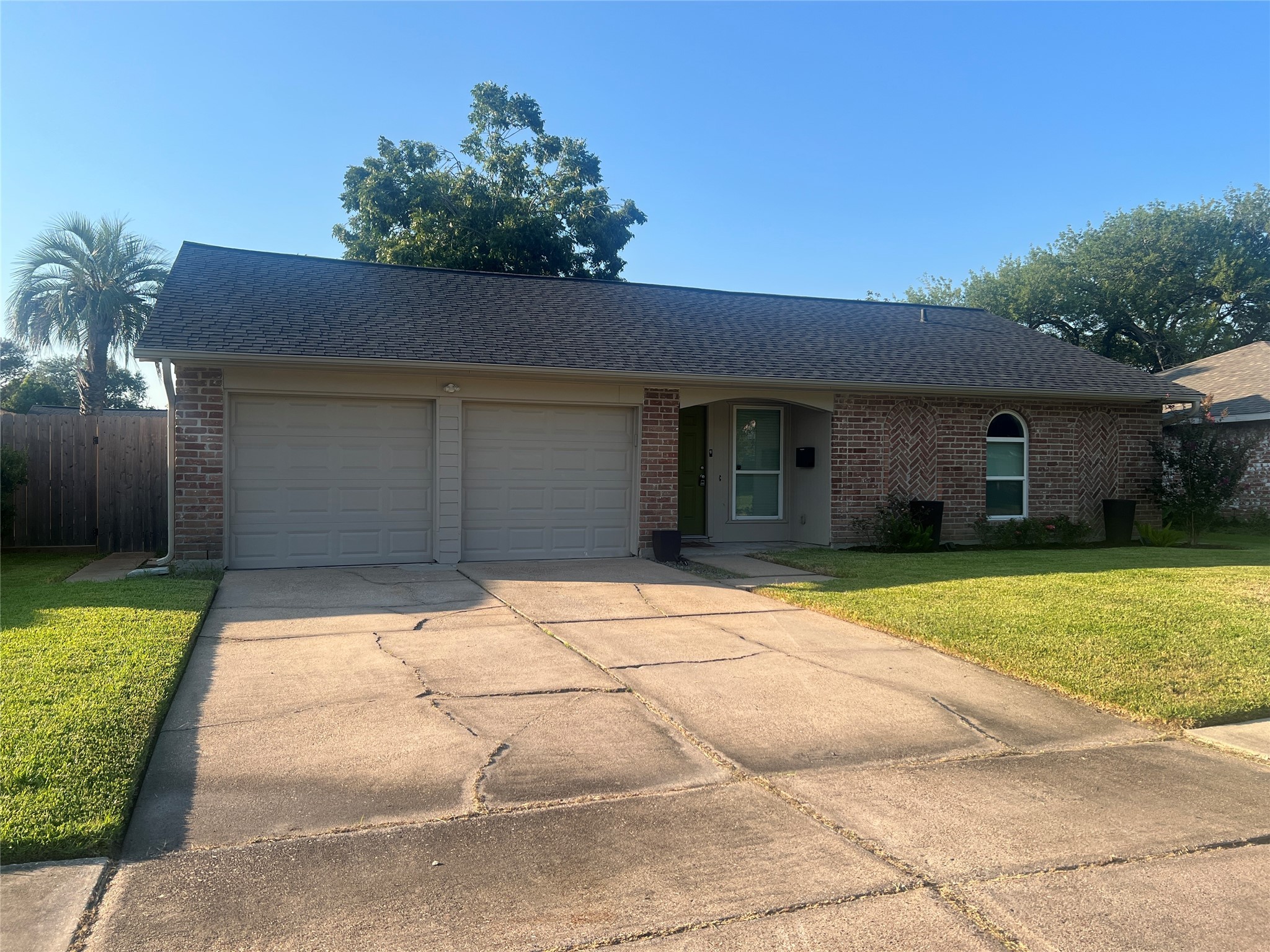 10507 Kirkdale Drive Houston, TX 77089 - Photo 2 of 7 a front view of a house with a yard and garage
