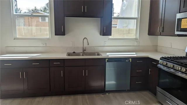 a kitchen with a sink and a stove