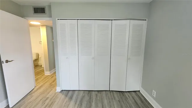 a view of front door with wooden floor