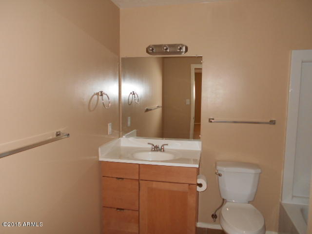 4 East Del Rio Drive Tempe, AZ 85282 - Photo 12 of 22 a bathroom with a toilet sink and mirror