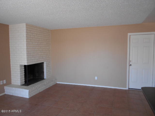 4 East Del Rio Drive Tempe, AZ 85282 - Photo 8 of 22 a view of an empty room with a fireplace
