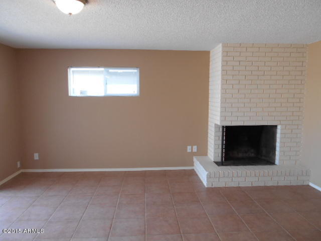 4 East Del Rio Drive Tempe, AZ 85282 - Photo 9 of 22 a view of a livingroom with a fireplace