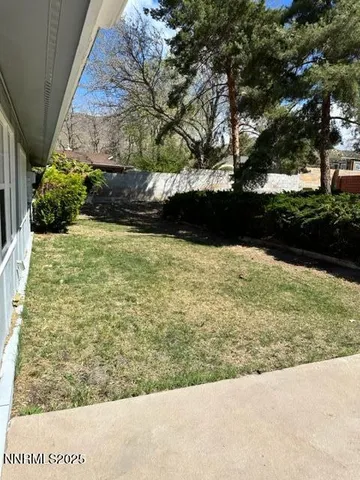 a view of a pathway both side of yard