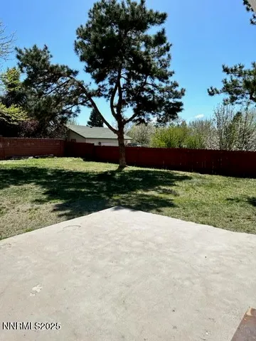 a view of backyard with green space
