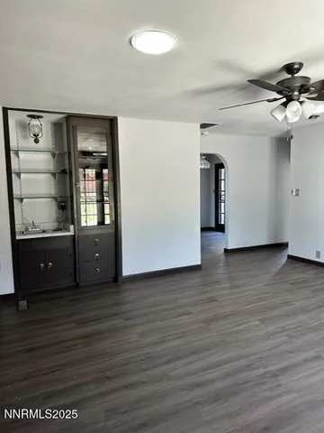 a view of a room with wooden floor