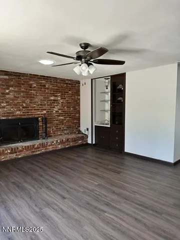 a view of a livingroom with wooden floor