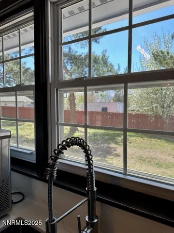 a view of a room with a large window