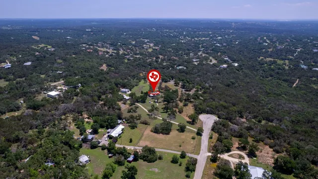 an aerial view of house with yard