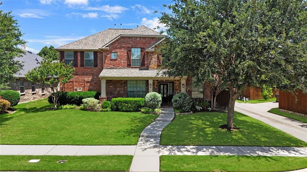 960 Remuda Road Frisco, TX 75033 - Photo 33 of 39 Traditional brick-faced residence featuring a gabled roofline and shutters