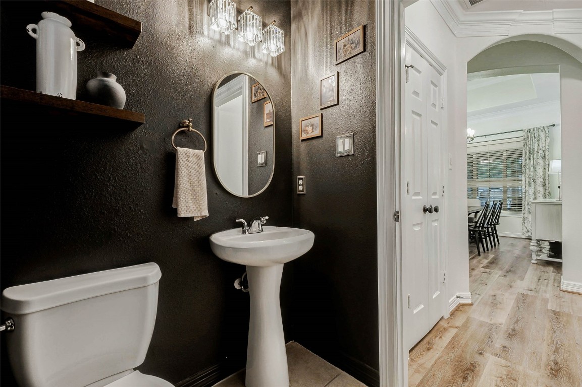 4403 Wickby Street Fulshear, TX 77441 - Photo 12 of 50 Offering plenty of privacy, the 1/2 bath is tucked away at the end of the hallway.