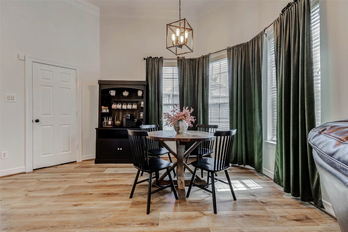 4403 Wickby Street Fulshear, TX 77441 - Photo 18 of 50 This inviting breakfast room offers an airy space with tall windows enhancing the room's warm atmosphere. Perfect for year round dining.