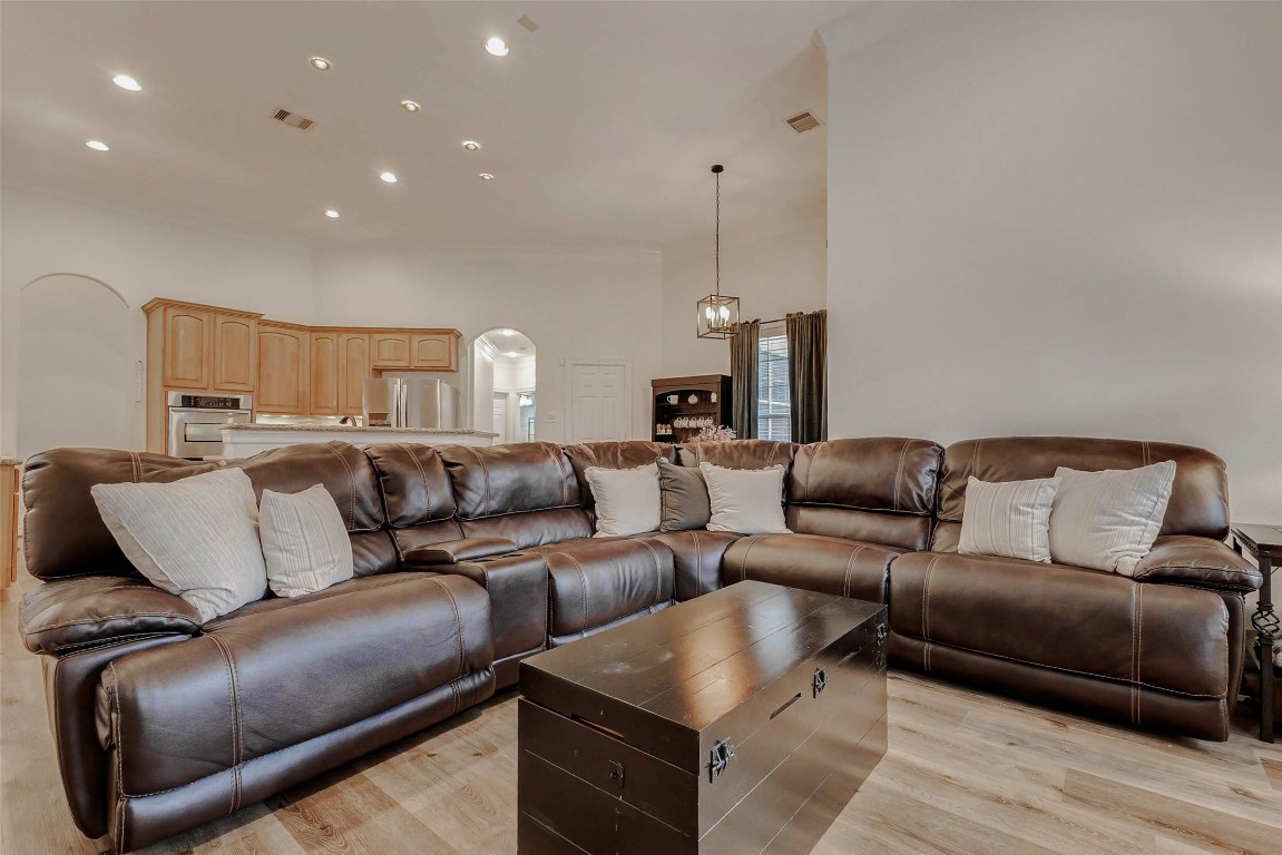 4403 Wickby Street Fulshear, TX 77441 - Photo 19 of 50 At the heart of the home, you will find the main living room to be a perfect place of rest. The open layout of living room flows effortlessly into the kitchen.