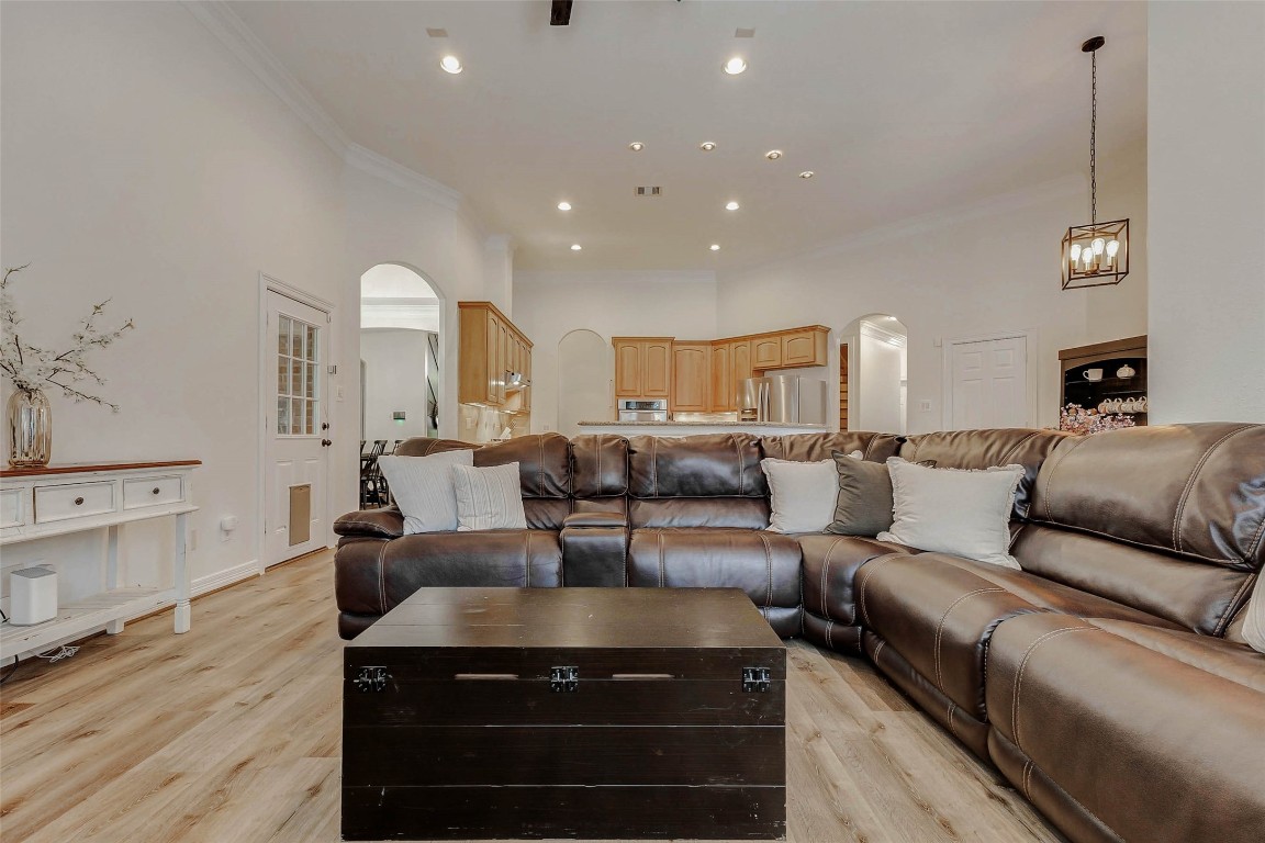 4403 Wickby Street Fulshear, TX 77441 - Photo 20 of 50 A welcoming space ideal for relaxation and entertaining, the living room offers a stylish gas fireplace creating both a cozy and functional focal point.
