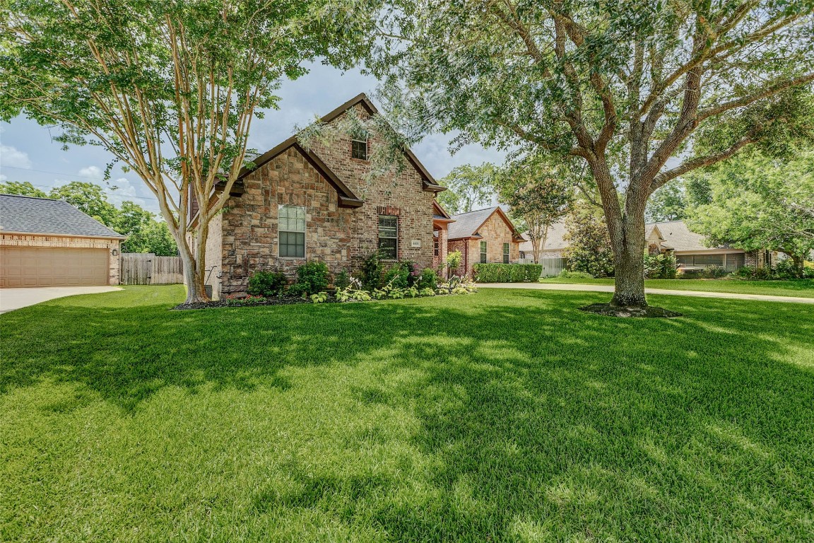 4403 Wickby Street Fulshear, TX 77441 - Photo 2 of 50 Pride in ownership truly shows with this pleasing curb appeal. There is also ample space for outdoor activities.