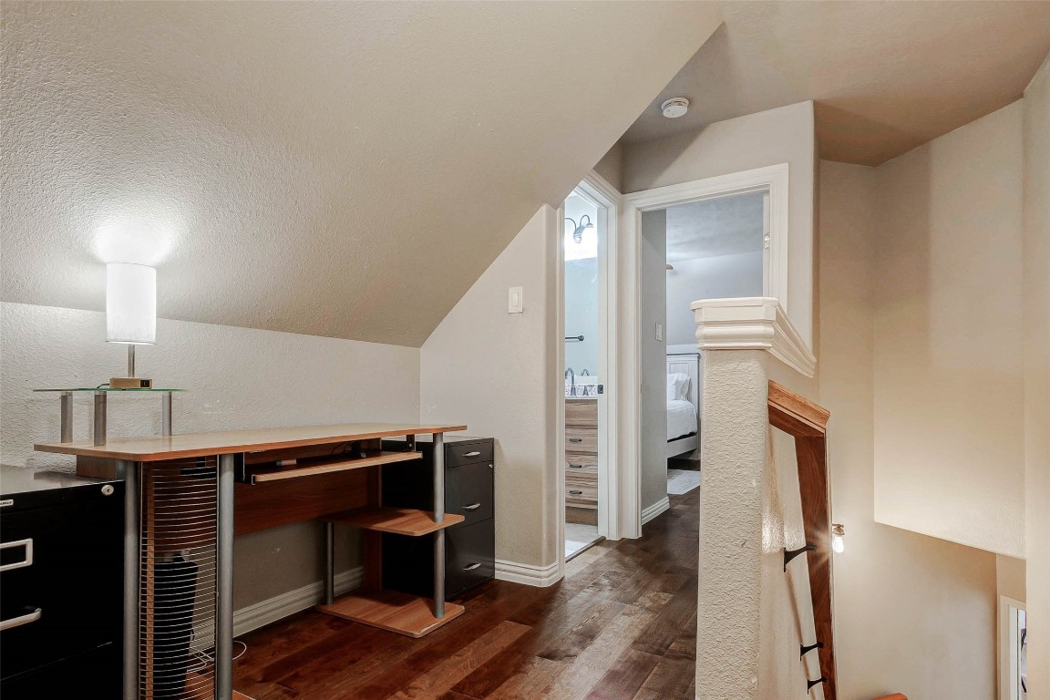 4403 Wickby Street Fulshear, TX 77441 - Photo 34 of 50 The upstairs landing features a compact workspace with the ability to have a built-in desk area, or it can even be used as a reading nook.
