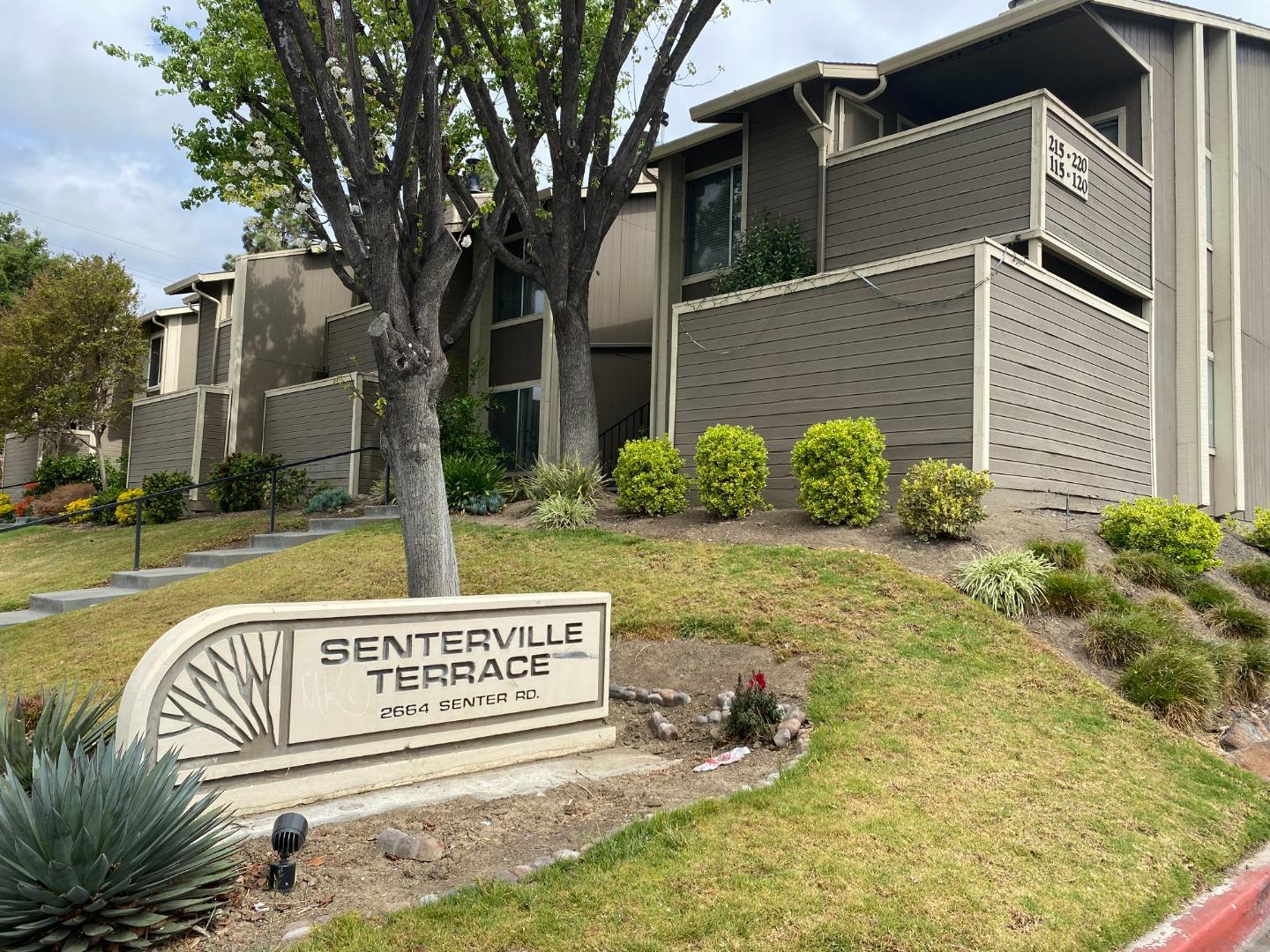 2664 Senter Road, Unit 223 San Jose, CA 95111 - Photo 2 of 11 a view of a street with potted plants and a large tree