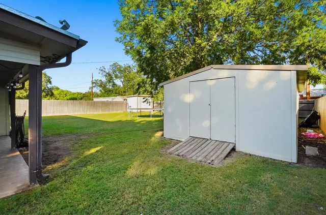 a backyard of a house with lots of green space