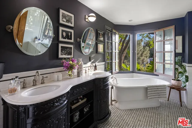 a living room with granite countertop furniture a fireplace and a large window