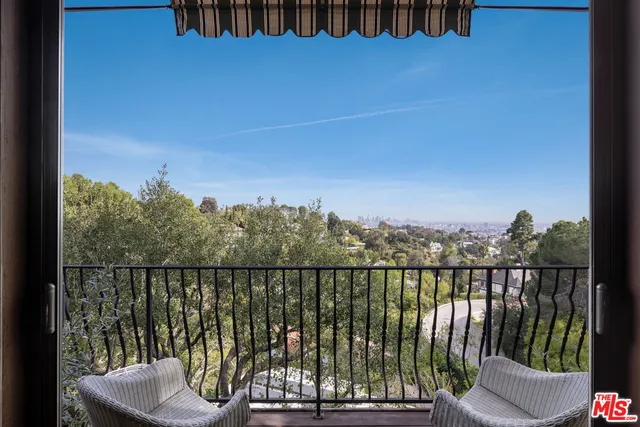 a view of a balcony with an ocean view