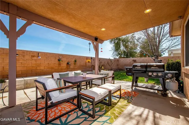 a view of an outdoor sitting area with furniture
