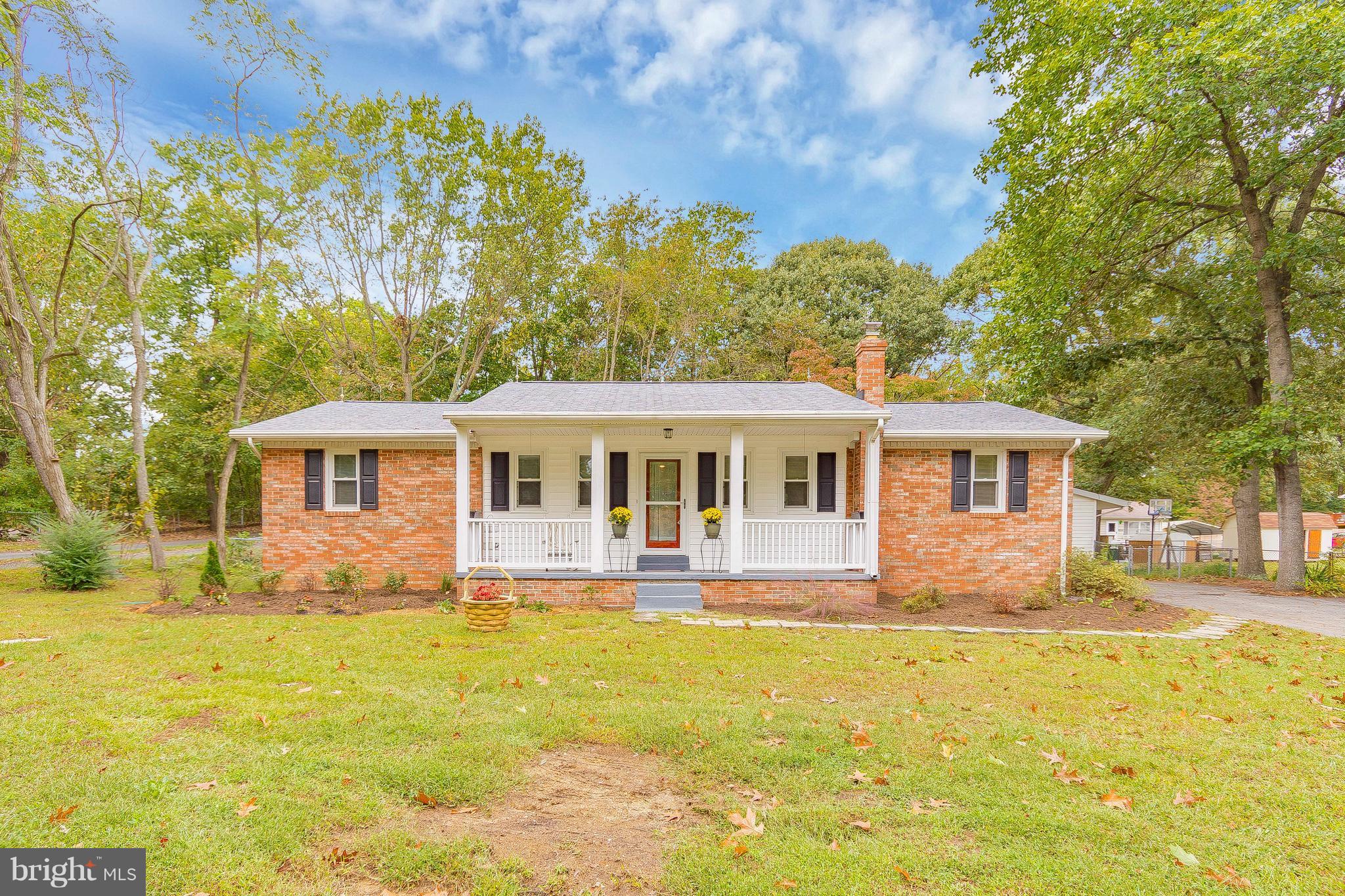 1218 Calvert Beach Road St. Leonard, MD 20685 - Photo 2 of 29 a front view of house with yard and green space