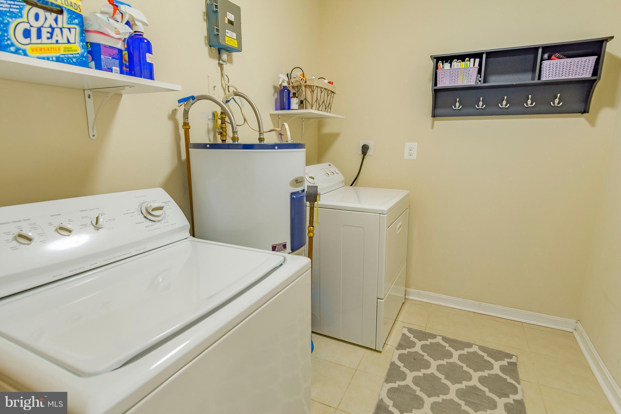 1218 Calvert Beach Road St. Leonard, MD 20685 - Photo 16 of 29 a utility room with dryer and washer