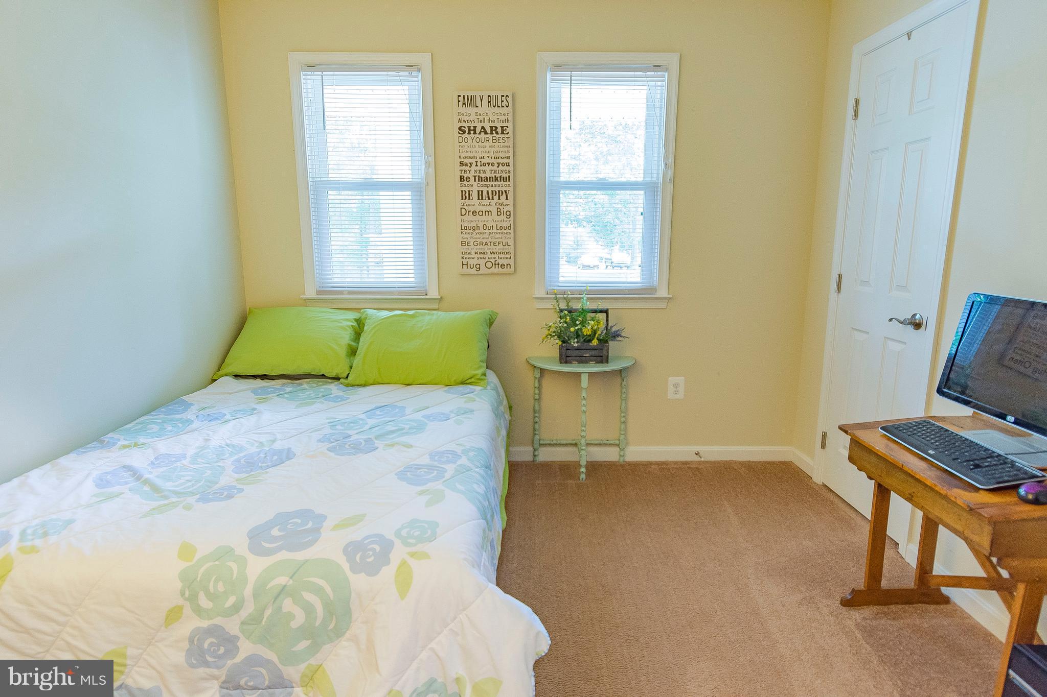 1218 Calvert Beach Road St. Leonard, MD 20685 - Photo 18 of 29 a bedroom with a bed and a window