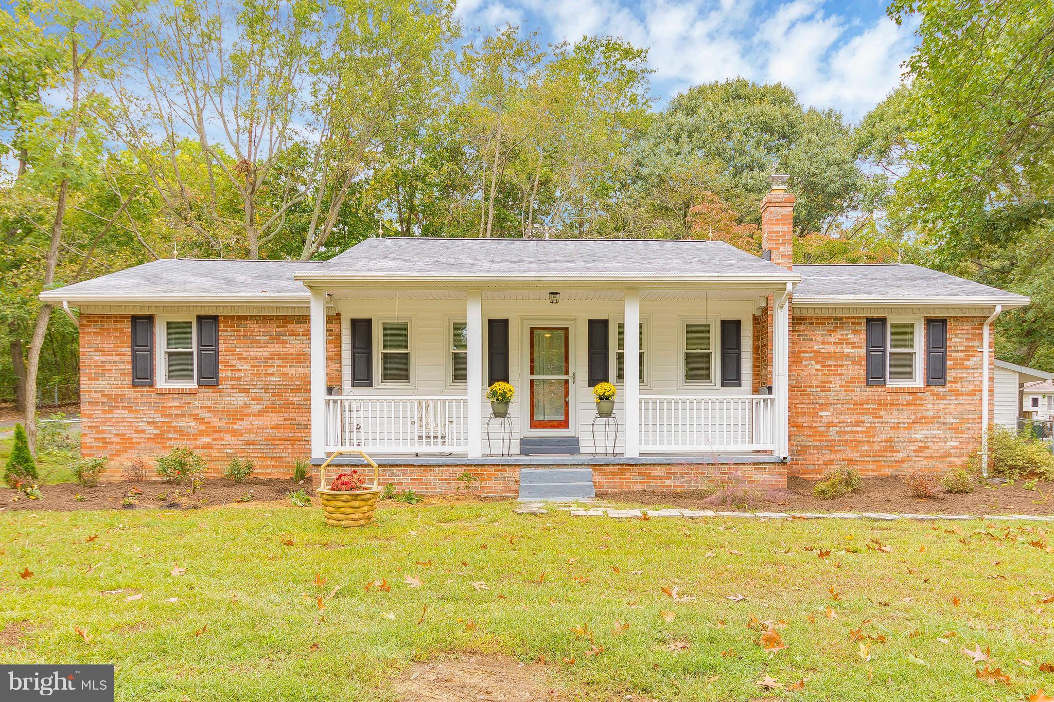 1218 Calvert Beach Road St. Leonard, MD 20685 - Photo 3 of 29 a front view of a house with a yard