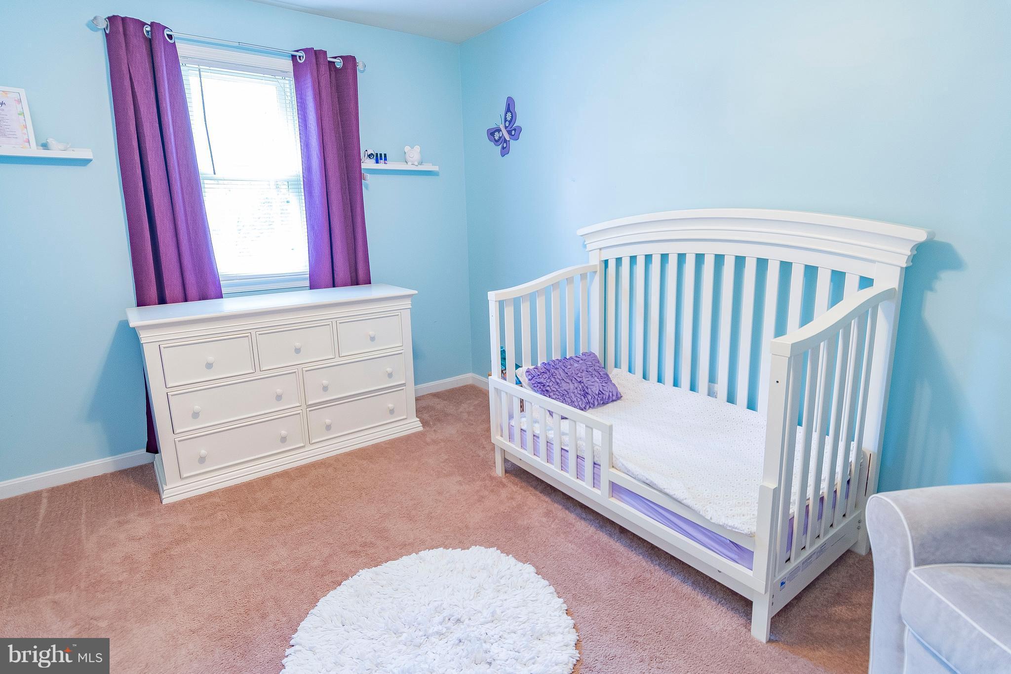 1218 Calvert Beach Road St. Leonard, MD 20685 - Photo 22 of 29 a bedroom with a bed and wooden floor
