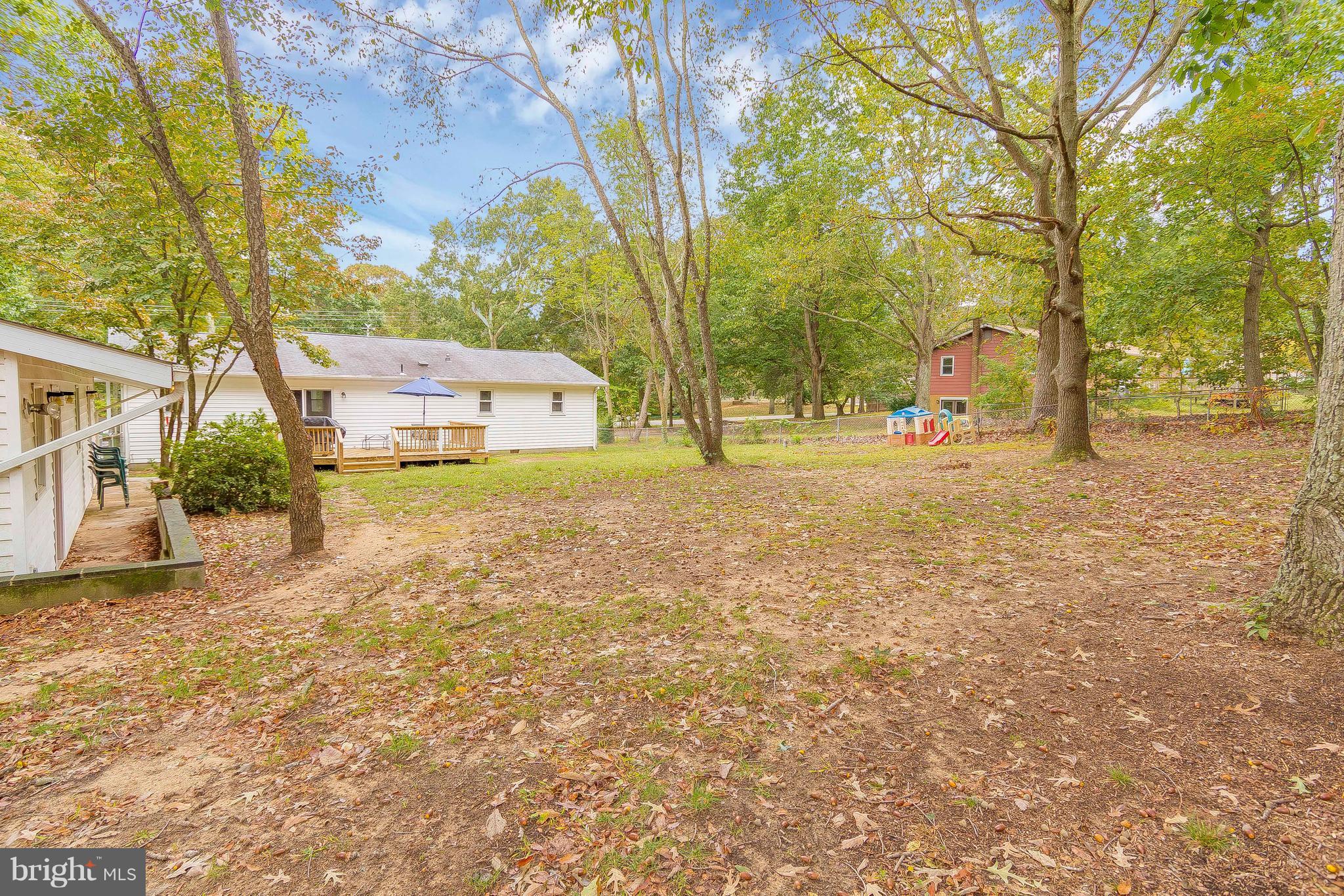 1218 Calvert Beach Road St. Leonard, MD 20685 - Photo 28 of 29 a view of a yard with a house and trees