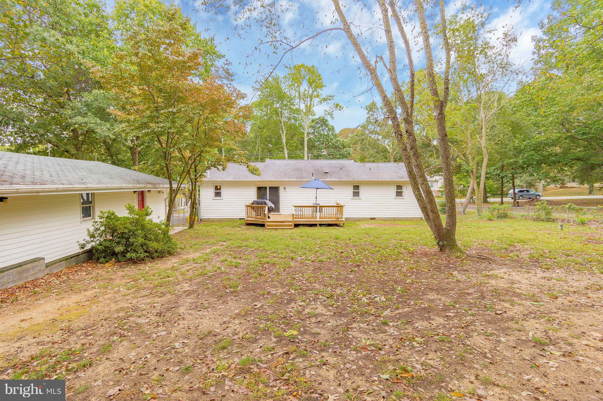 1218 Calvert Beach Road St. Leonard, MD 20685 - Photo 29 of 29 a view of a house with backyard and a tree