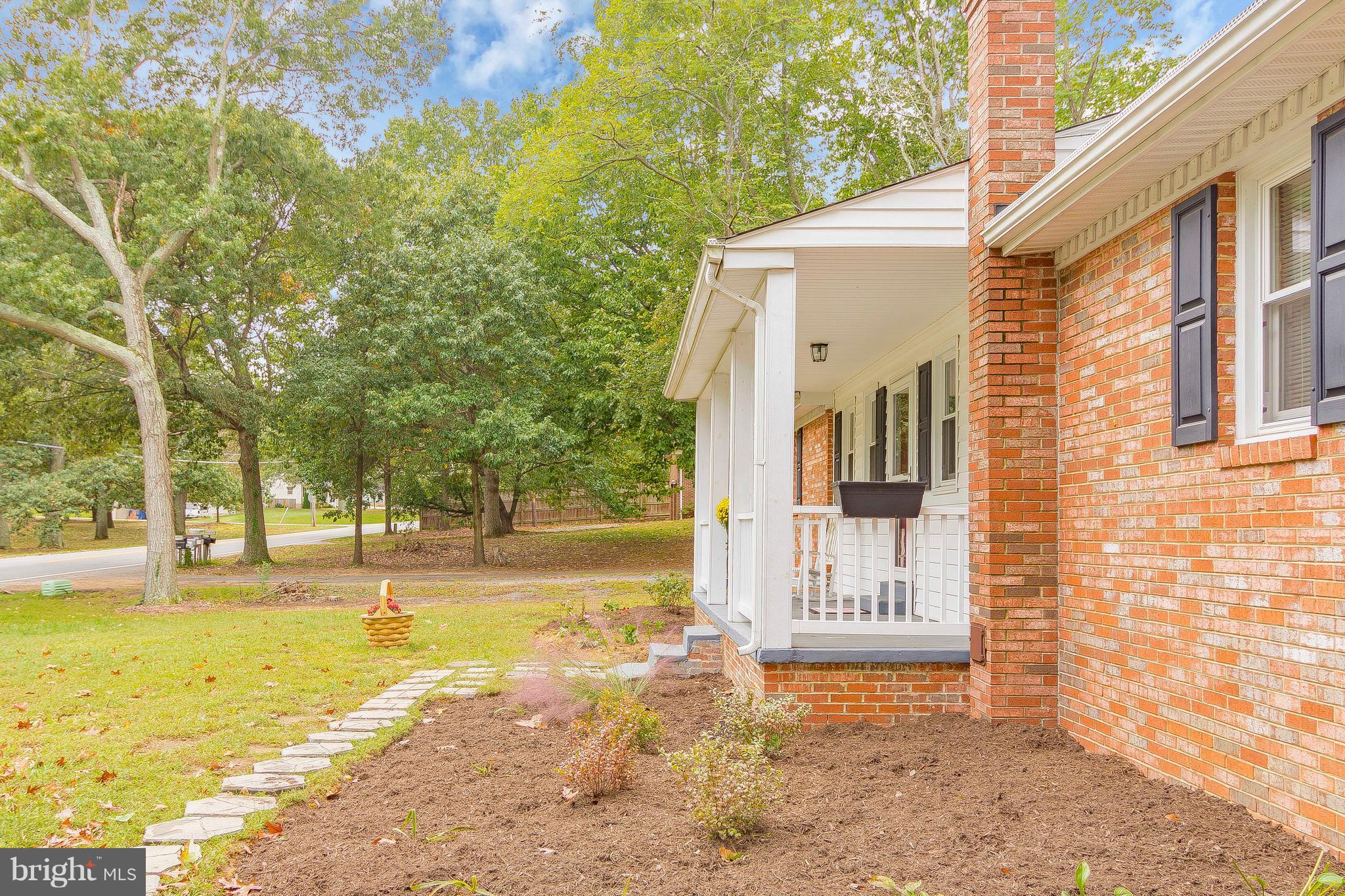 1218 Calvert Beach Road St. Leonard, MD 20685 - Photo 4 of 29 a view of a house with backyard and trees