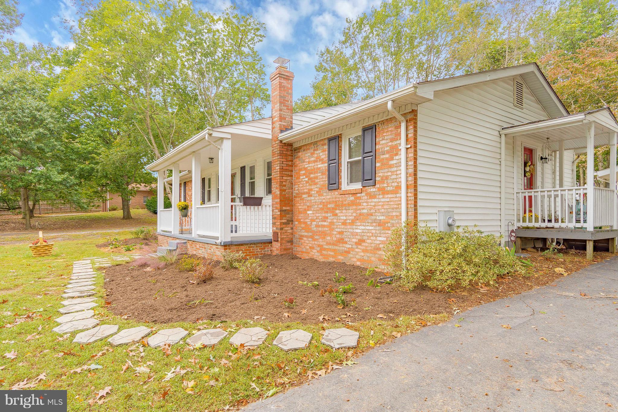 1218 Calvert Beach Road St. Leonard, MD 20685 - Photo 5 of 29 a front view of a house with a yard