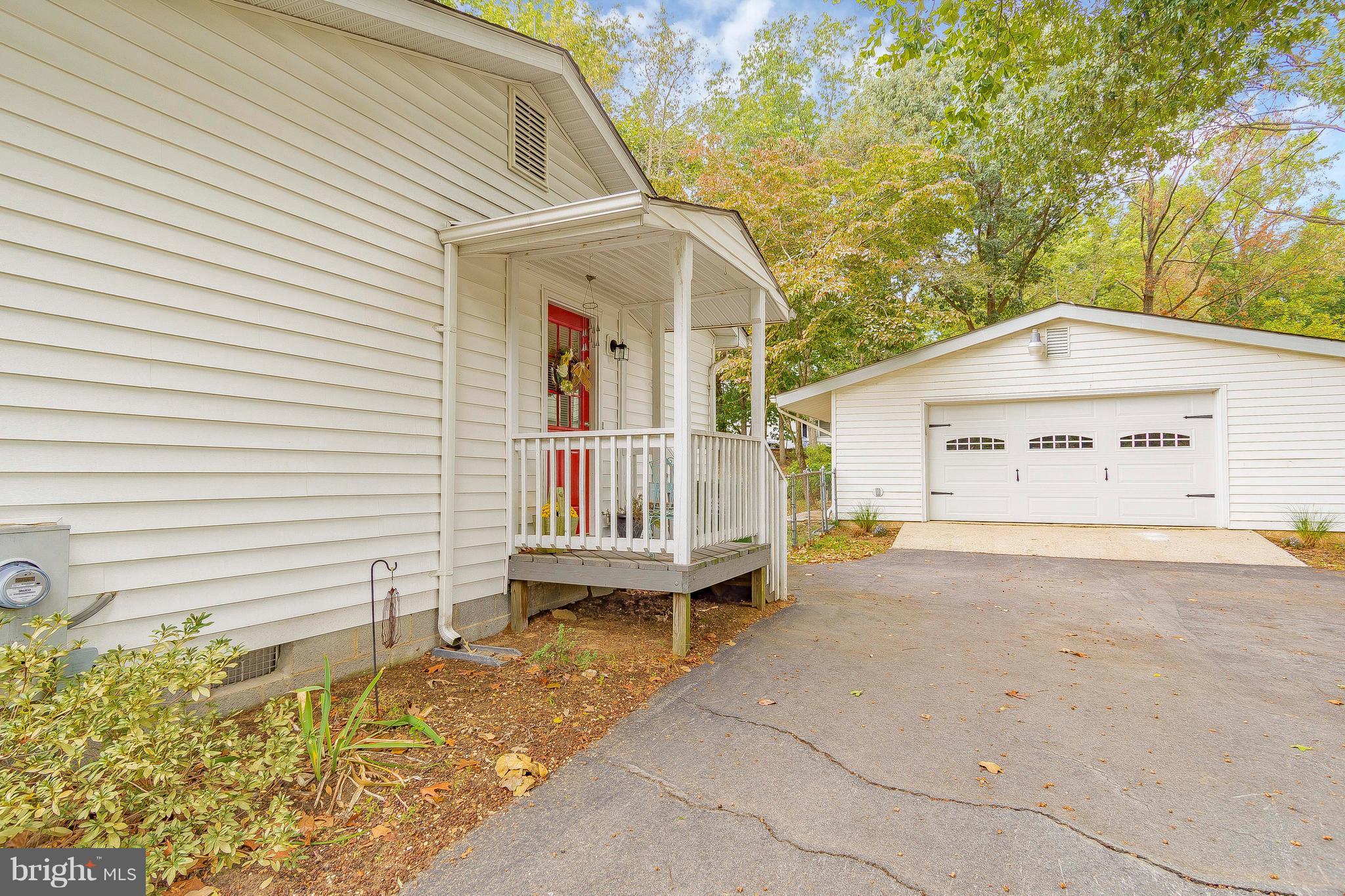 1218 Calvert Beach Road St. Leonard, MD 20685 - Photo 6 of 29 a view of a house with a wooden fence