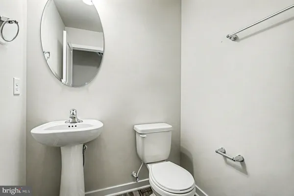 an empty room with ceiling fan and window