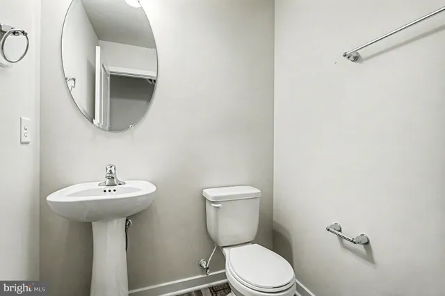 an empty room with ceiling fan and window