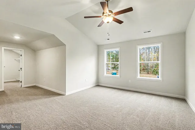 a bathroom with double vanity sinks and a bathtub