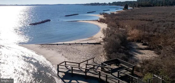 a lake view with a building in the background