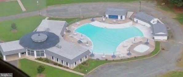 swimming pool view with a outdoor seating