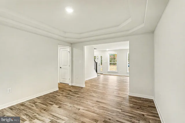 a kitchen with a sink refrigerator and cabinets