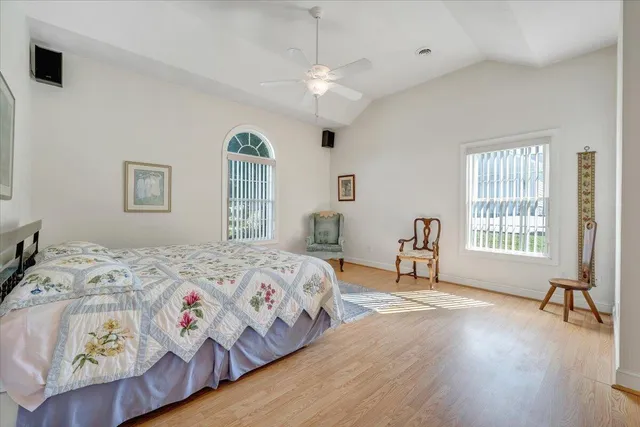 a view of a garage with a bike and a white car