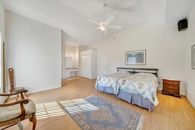 a view of walk in closet with clothes washer and dryer